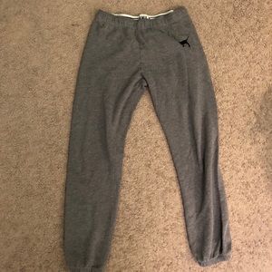 Grey sweatpants. Cuffed ends.